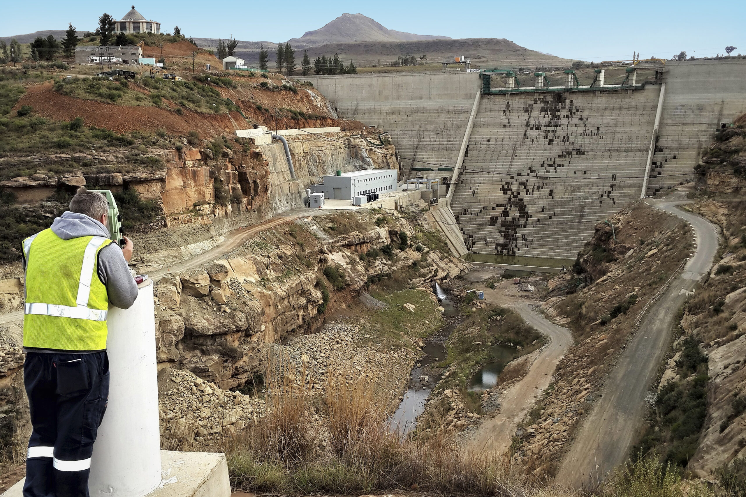 Lloyd Hill surveying and monitoring a dam, using Viinplan to document survey projects