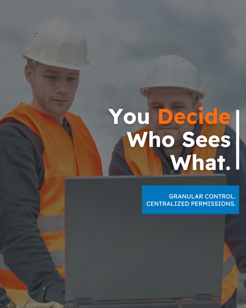 Two engineers in hard hats reviewing access settings on a computer, representing Viinplan’s granular control and centralized permissions